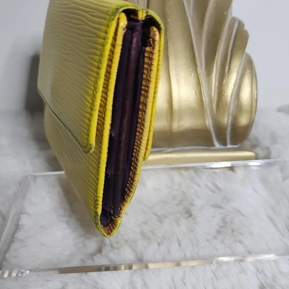 Louis Vuitton Elise Trifold Wallet crafted from their signature Tassil Yellow Ep